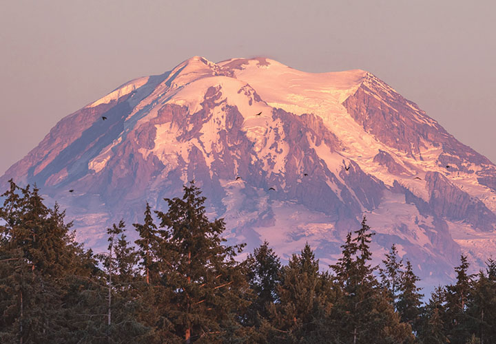 Snowcapped mountain during sunset